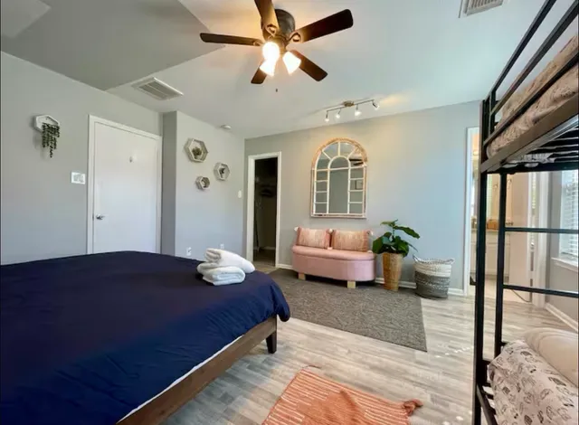 a bedroom with a bed and window