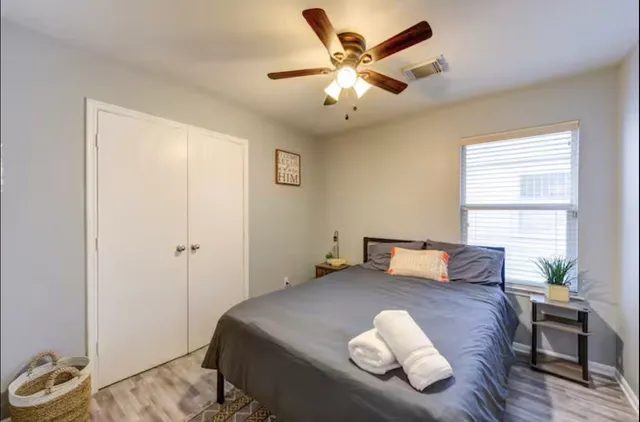 a kitchen with white cabinets and appliances