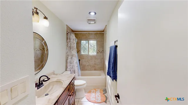 a bathroom with a bathtub and a sink