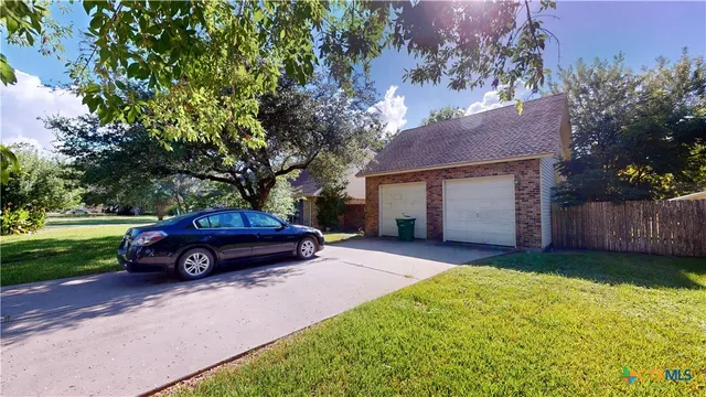 a view of a park with large trees