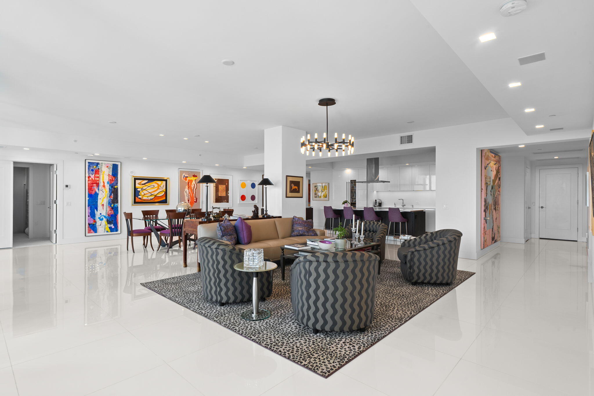 20155 Boca W Drive, Unit A404 Boca Raton, FL 33434 - Photo 4 of 52 a living room with lots of furniture and a chandelier