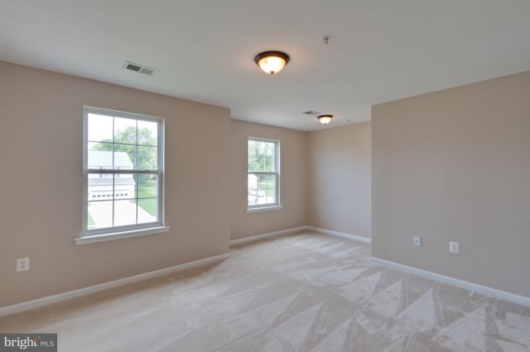 5919 Plata Street Clinton, MD 20735 - Photo 16 of 25 a view of an empty room with a window