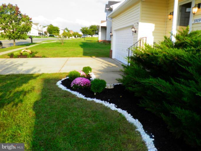 5919 Plata Street Clinton, MD 20735 - Photo 21 of 25 a view of a house with a backyard