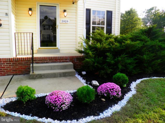 5919 Plata Street Clinton, MD 20735 - Photo 24 of 25 a view of a flowers in front of a house