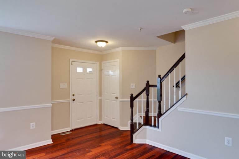 5919 Plata Street Clinton, MD 20735 - Photo 9 of 25 a view of entryway with wooden floor