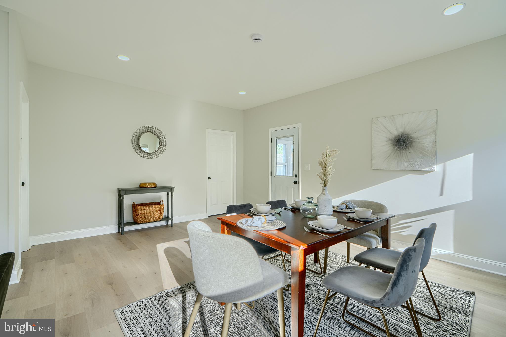 2126 Oakland Road Baltimore, MD 21220 - Photo 11 of 53 a dining room with a table and chairs