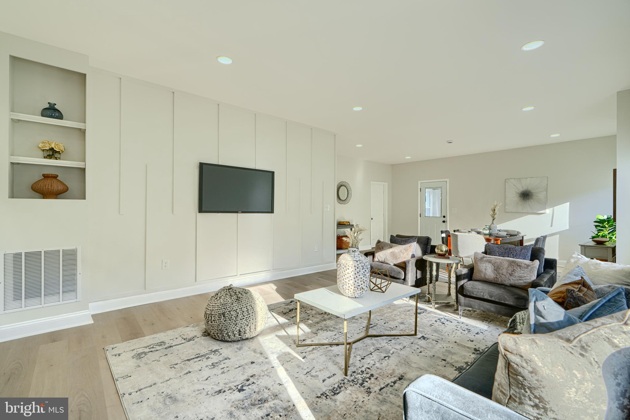 2126 Oakland Road Baltimore, MD 21220 - Photo 15 of 53 a living room with furniture and a flat screen tv
