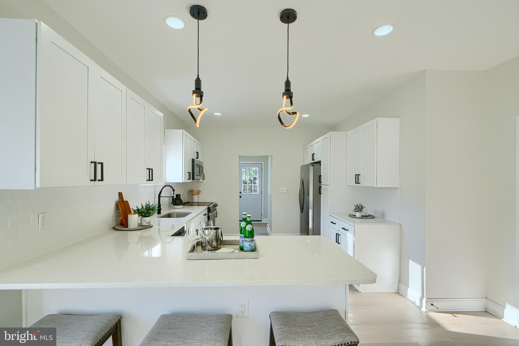 2126 Oakland Road Baltimore, MD 21220 - Photo 18 of 53 a view of dining room and kitchen with a table