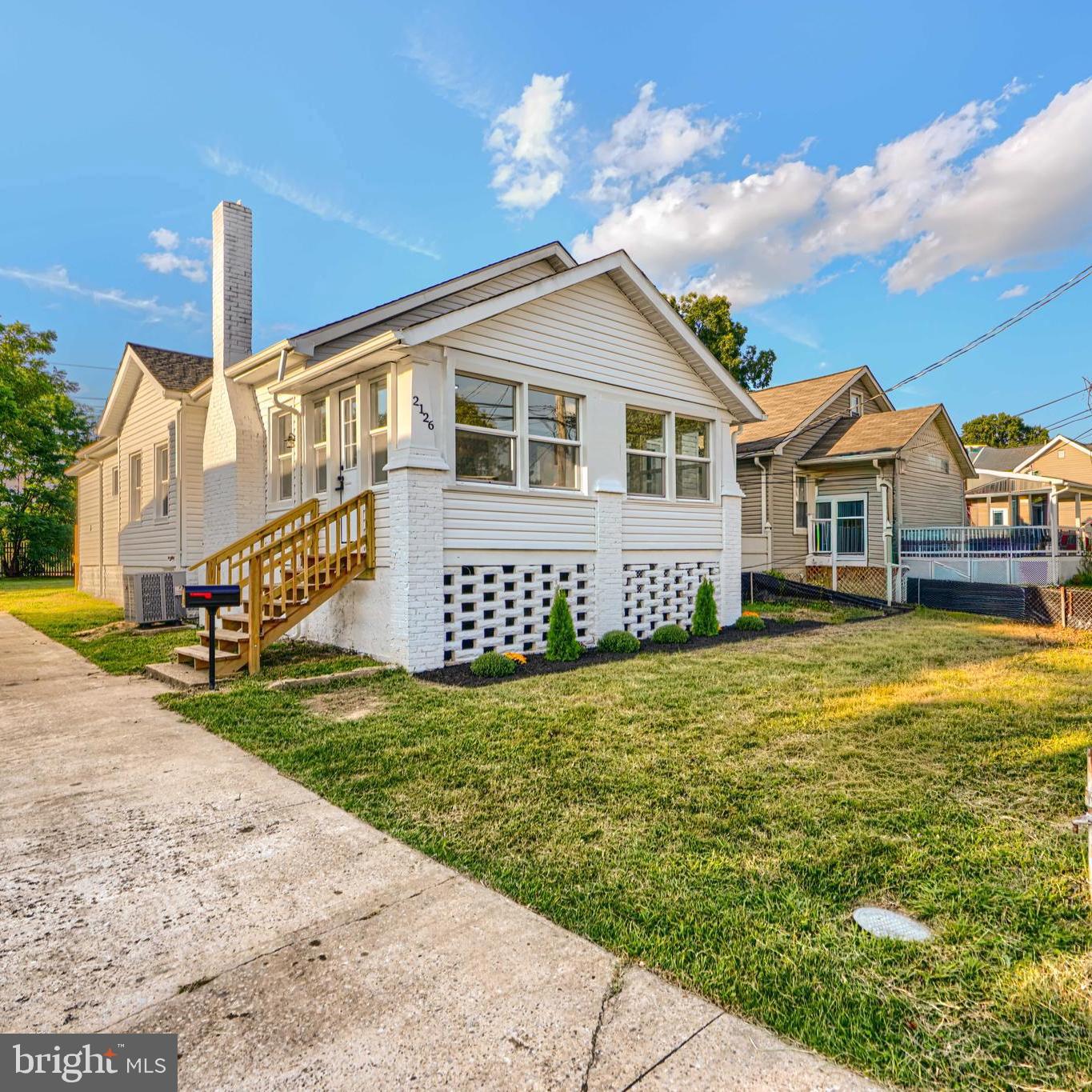 2126 Oakland Road Baltimore, MD 21220 - Photo 2 of 53 a front view of a house with garden