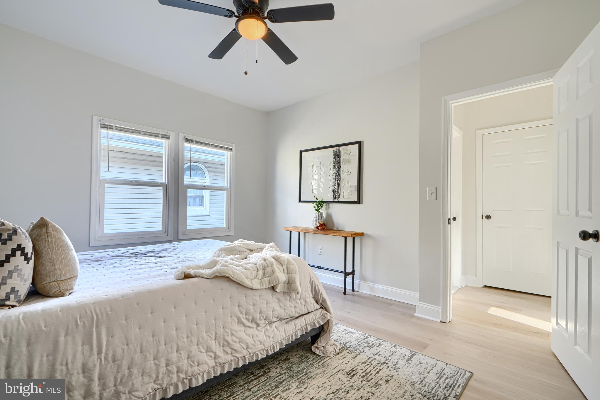 2126 Oakland Road Baltimore, MD 21220 - Photo 27 of 53 a bedroom with a bed and wooden floor