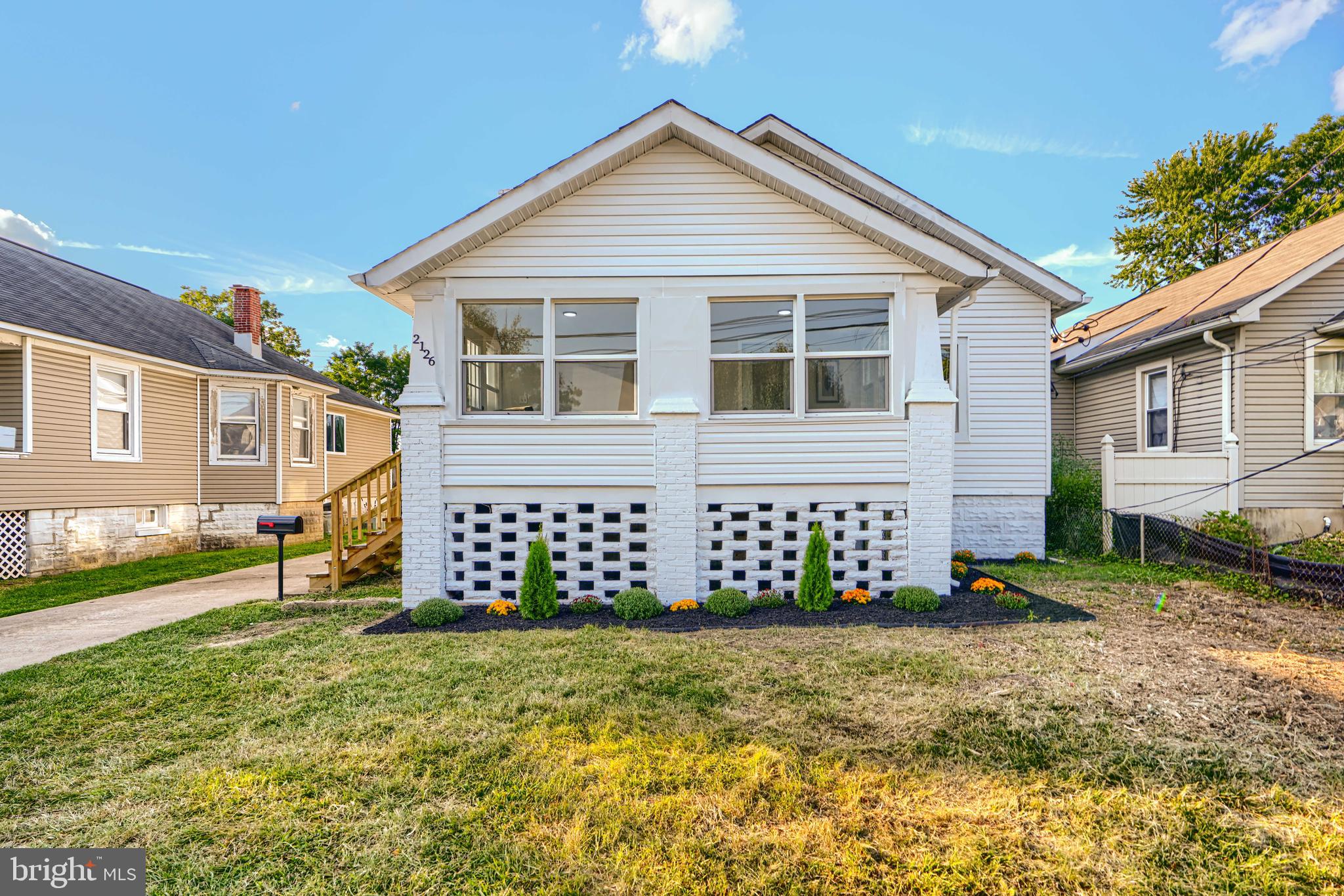 2126 Oakland Road Baltimore, MD 21220 - Photo 3 of 53 front view of a house with a yard