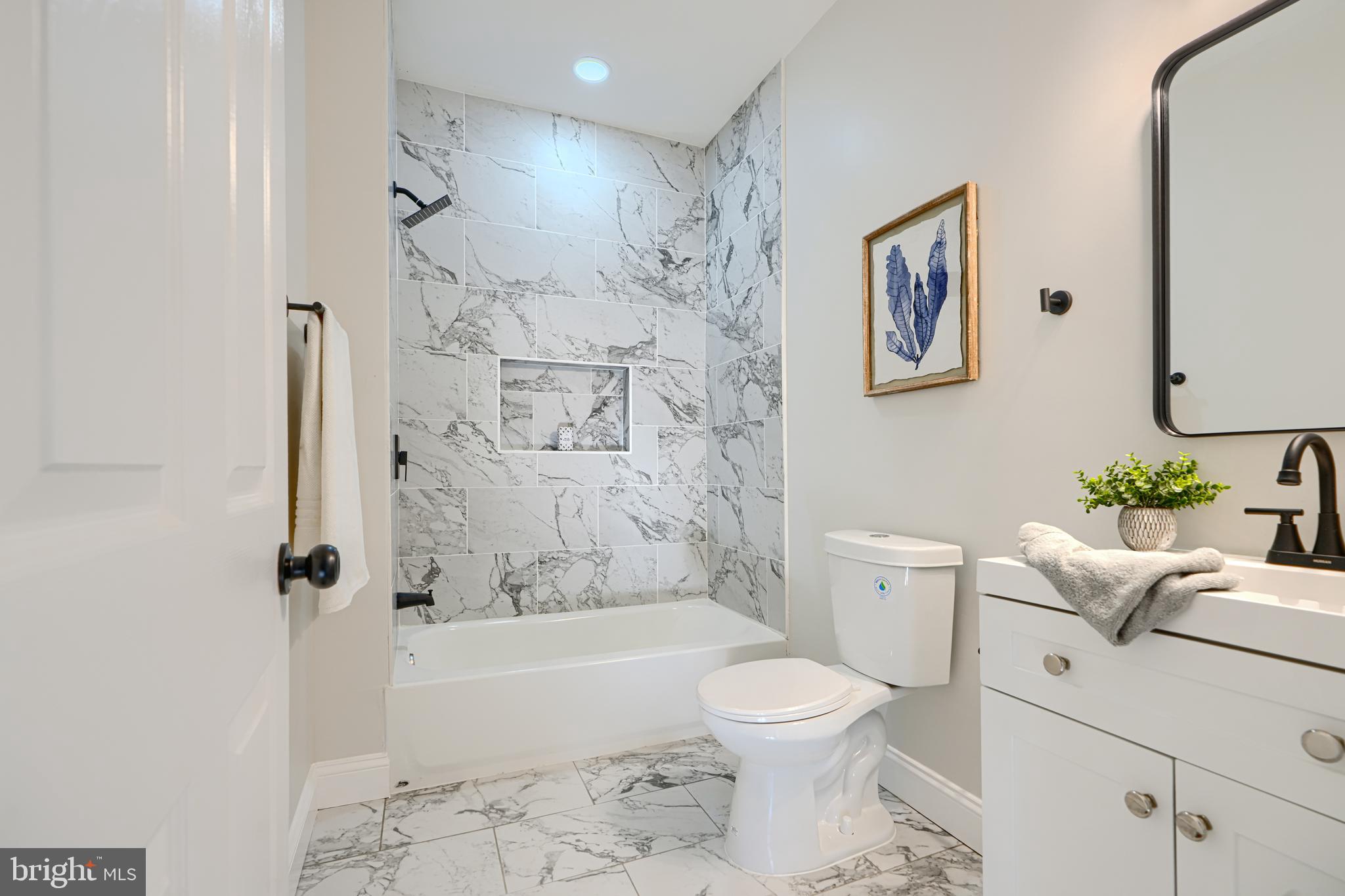 2126 Oakland Road Baltimore, MD 21220 - Photo 31 of 53 a bathroom with a toilet a sink and bathtub