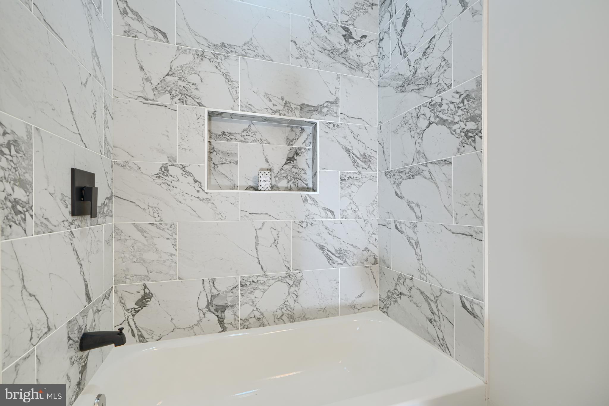 2126 Oakland Road Baltimore, MD 21220 - Photo 33 of 53 a bathroom with a bathtub and shower