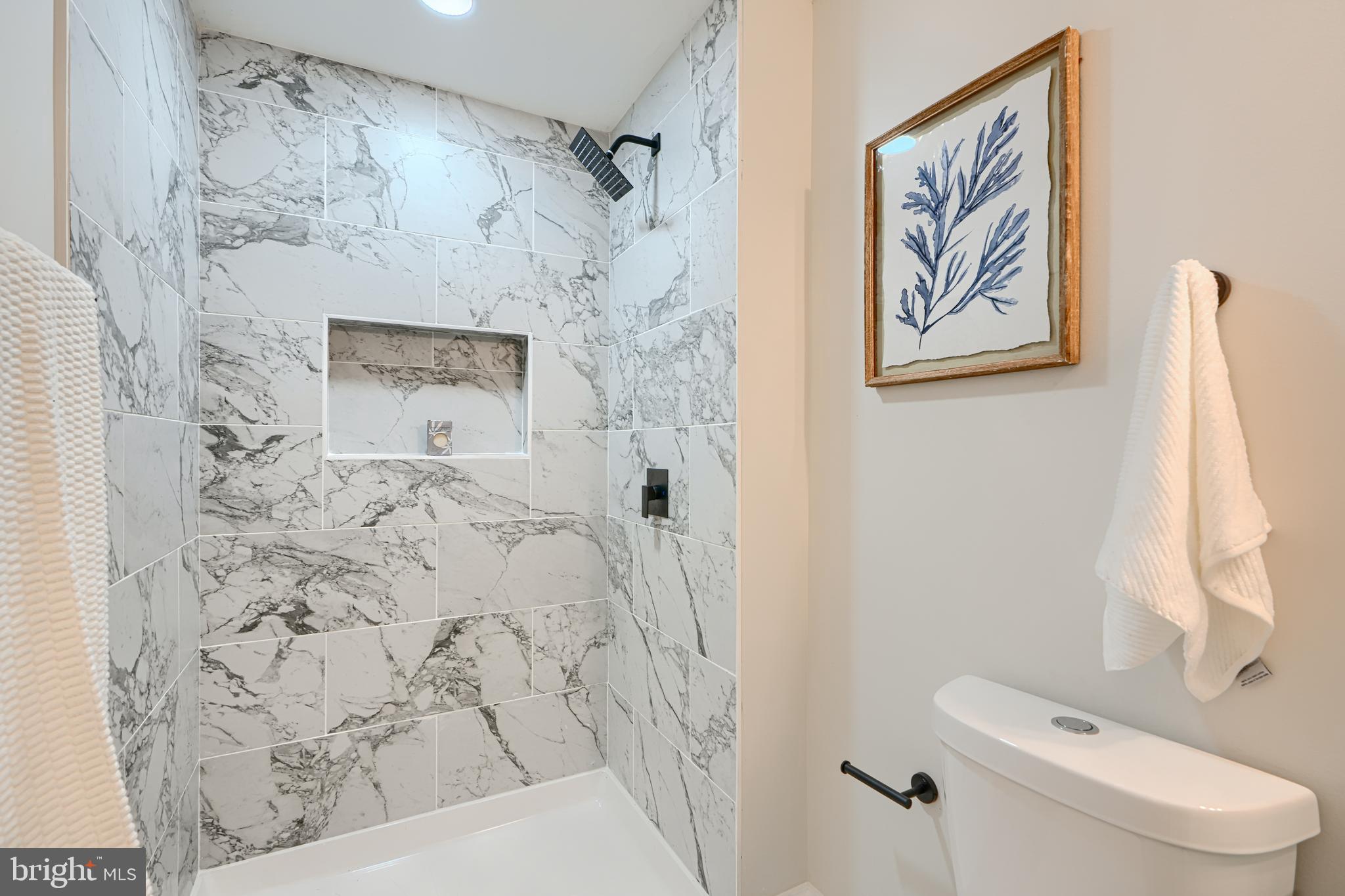 2126 Oakland Road Baltimore, MD 21220 - Photo 40 of 53 a bathroom with a toilet and a shower curtain