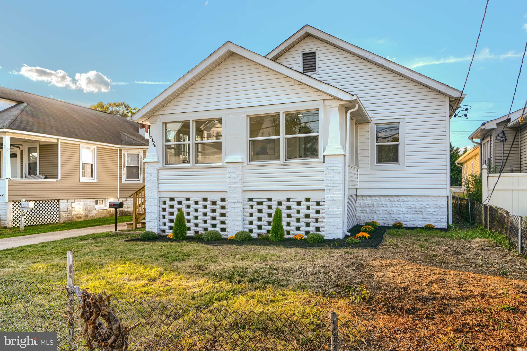 2126 Oakland Road Baltimore, MD 21220 - Photo 4 of 53 a front view of a house with a yard