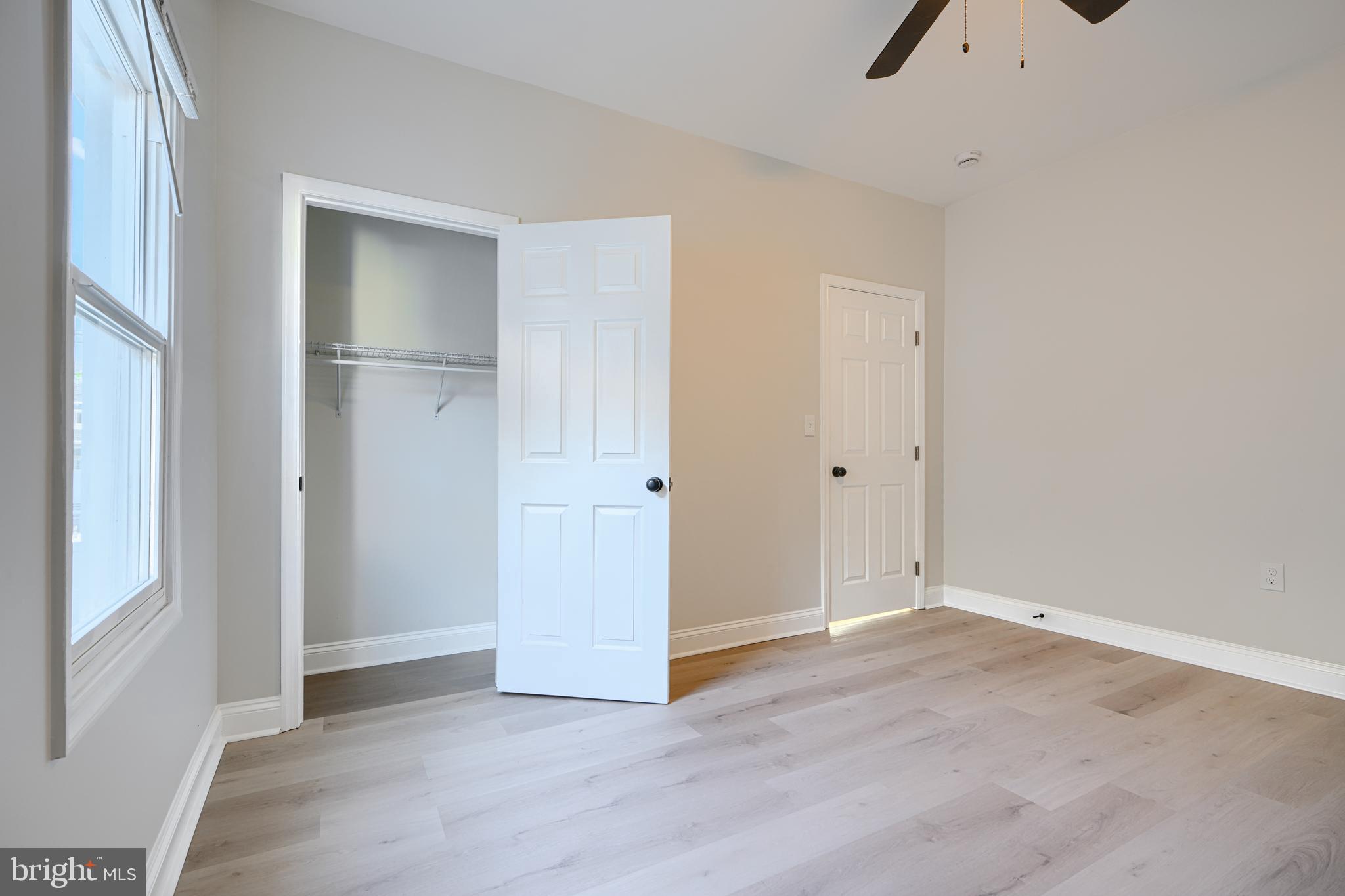 2126 Oakland Road Baltimore, MD 21220 - Photo 43 of 53 an empty room with closet and windows