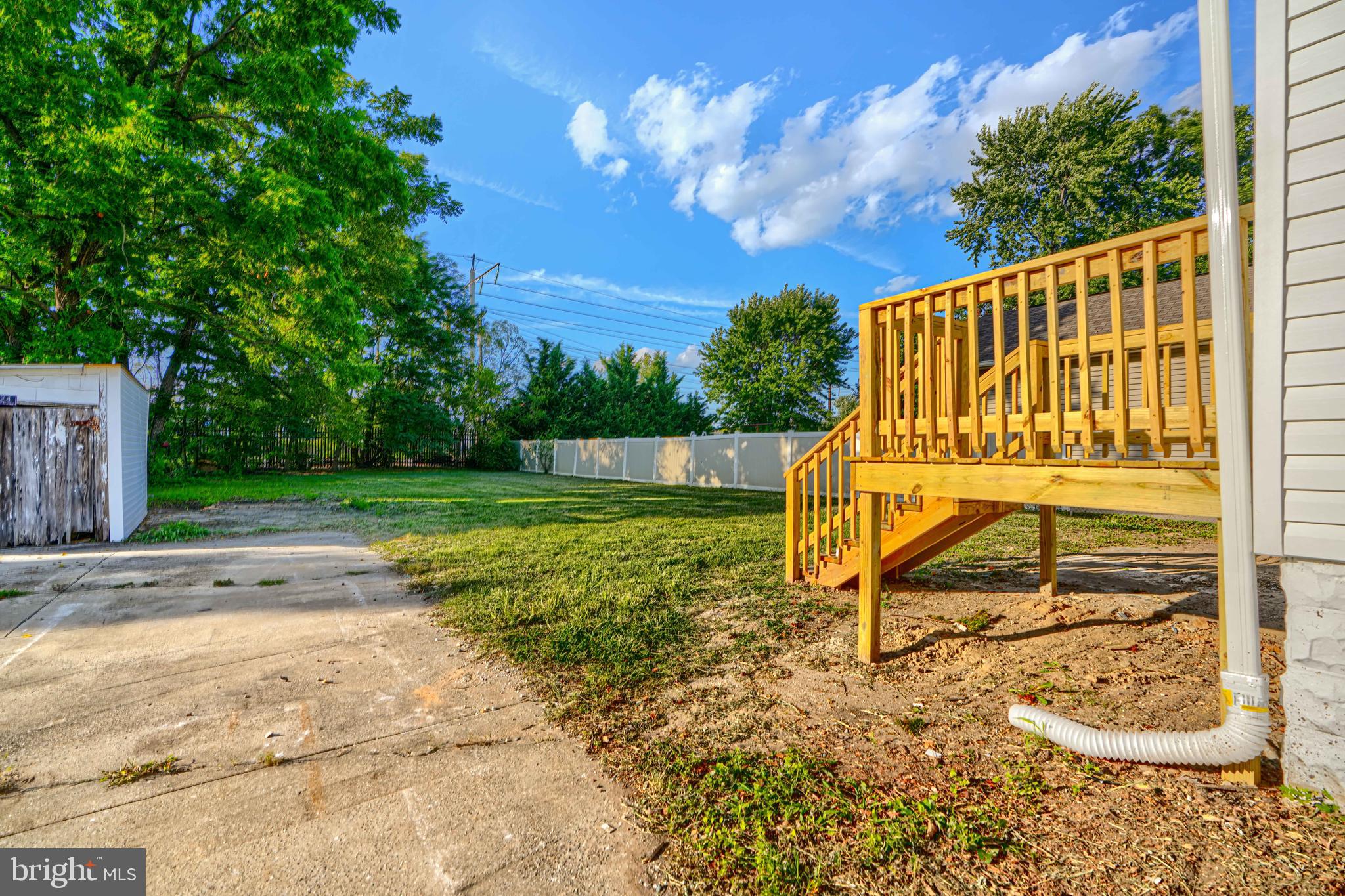 2126 Oakland Road Baltimore, MD 21220 - Photo 49 of 53 a view of a chair and table in the yard with wooden fence