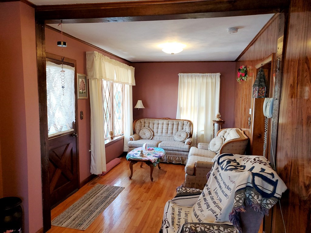 135 Knight Street Woonsocket, RI 02895 - Photo 5 of 28 a living room with furniture and wooden floor