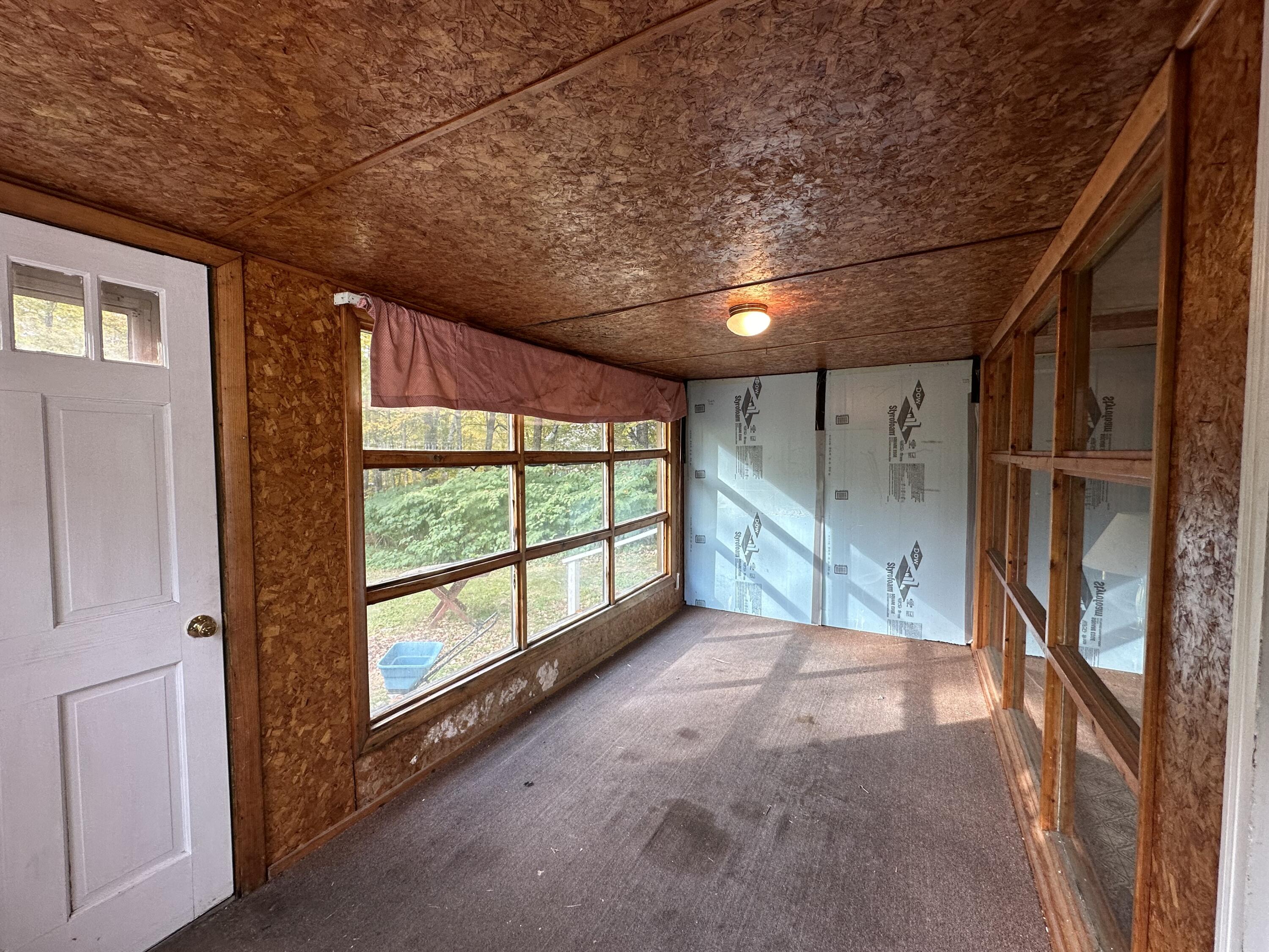 123 Turner Howe Road Milo, ME 04463 - Photo 31 of 44 glassed in porch