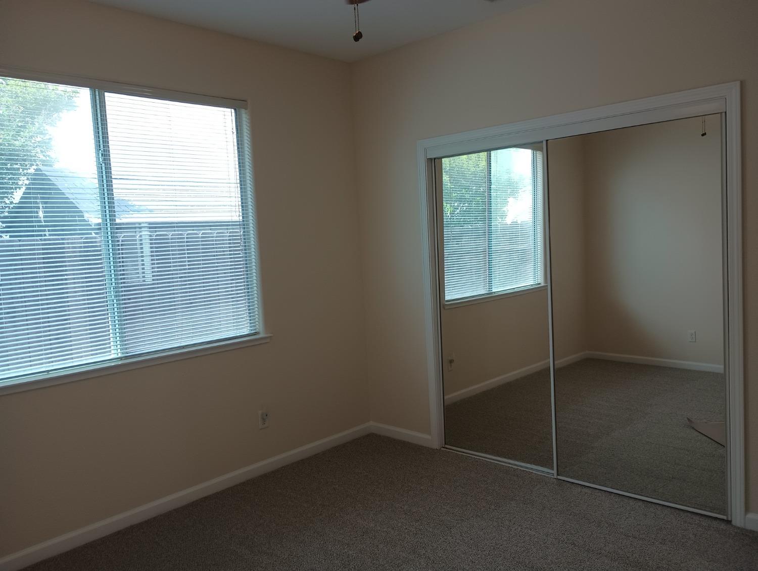 2979 Duncan Avenue Clovis, CA 93611 - Photo 12 of 27 an empty room with windows
