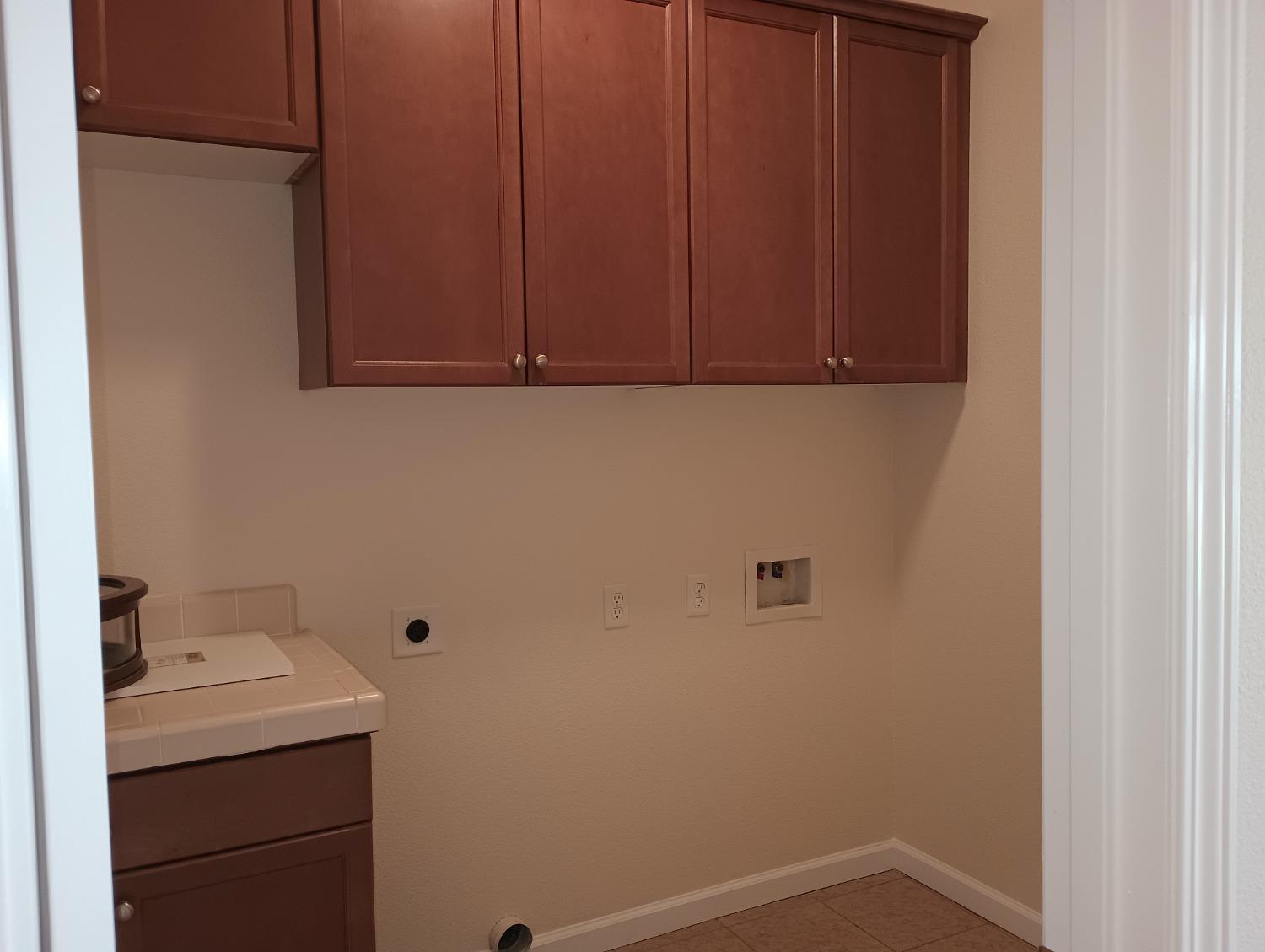 2979 Duncan Avenue Clovis, CA 93611 - Photo 16 of 27 a bathroom with a sink and cabinets