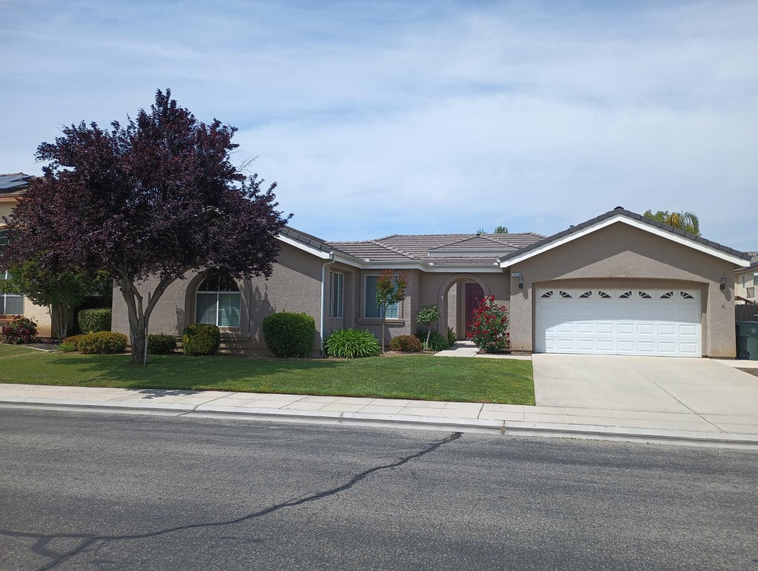2979 Duncan Avenue Clovis, CA 93611 - Photo 2 of 27 a view of road with a house in the background