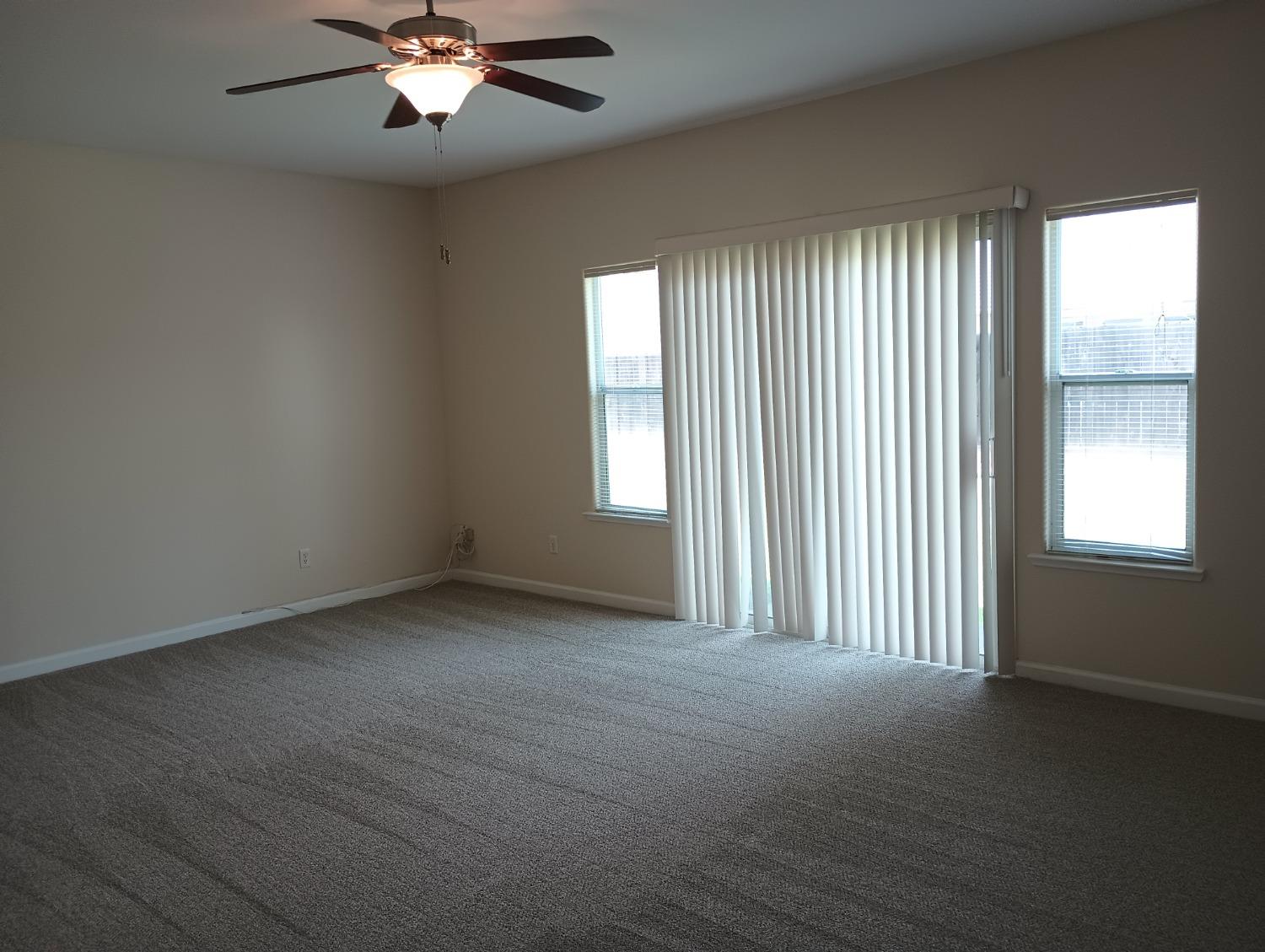 2979 Duncan Avenue Clovis, CA 93611 - Photo 21 of 27 an empty room with a window and a ceiling fan
