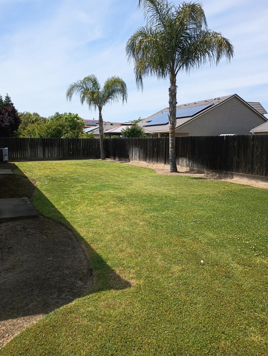 2979 Duncan Avenue Clovis, CA 93611 - Photo 22 of 27 a view of a swimming pool with a yard