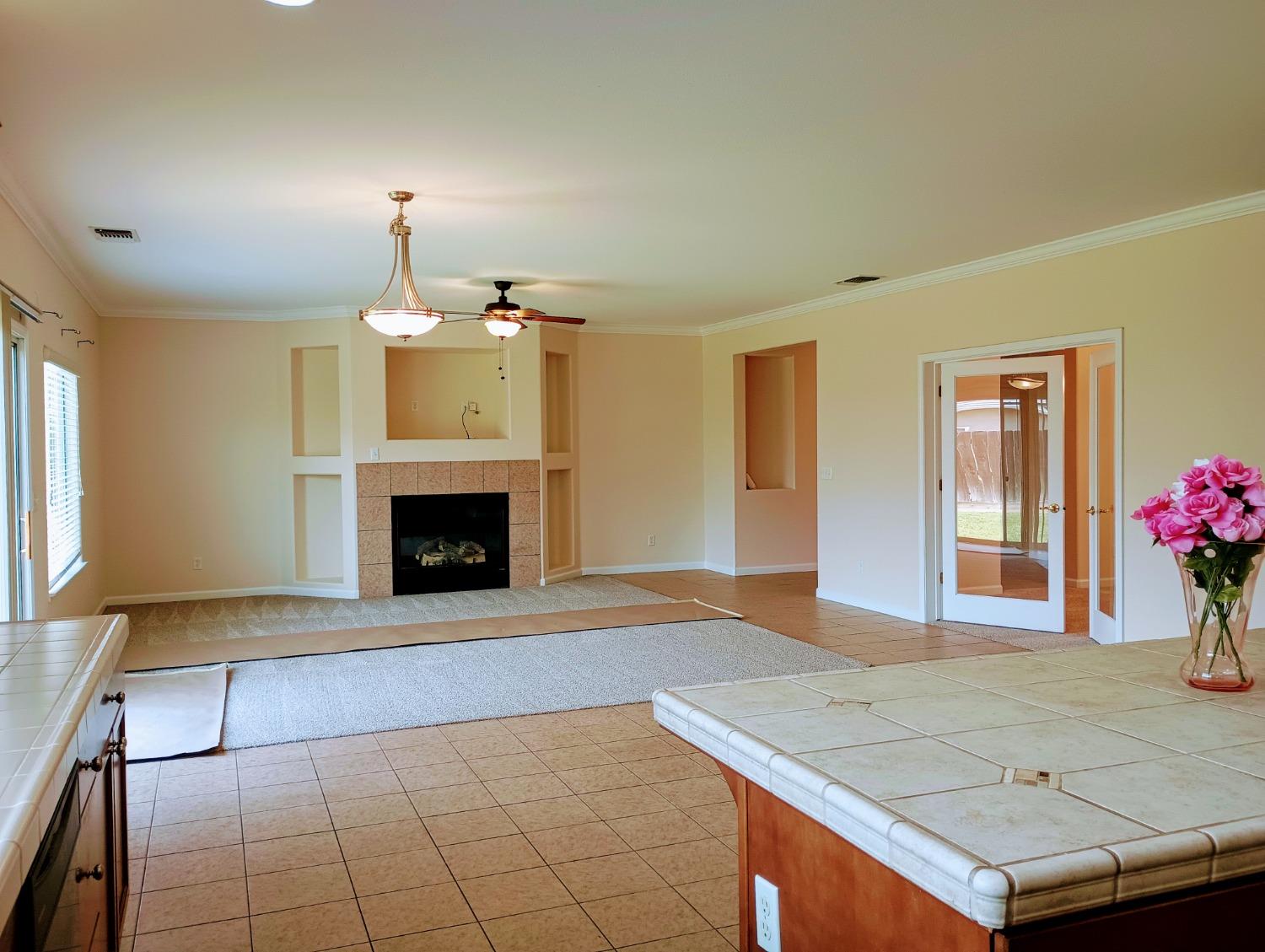 2979 Duncan Avenue Clovis, CA 93611 - Photo 7 of 27 a view of an empty room with a fireplace