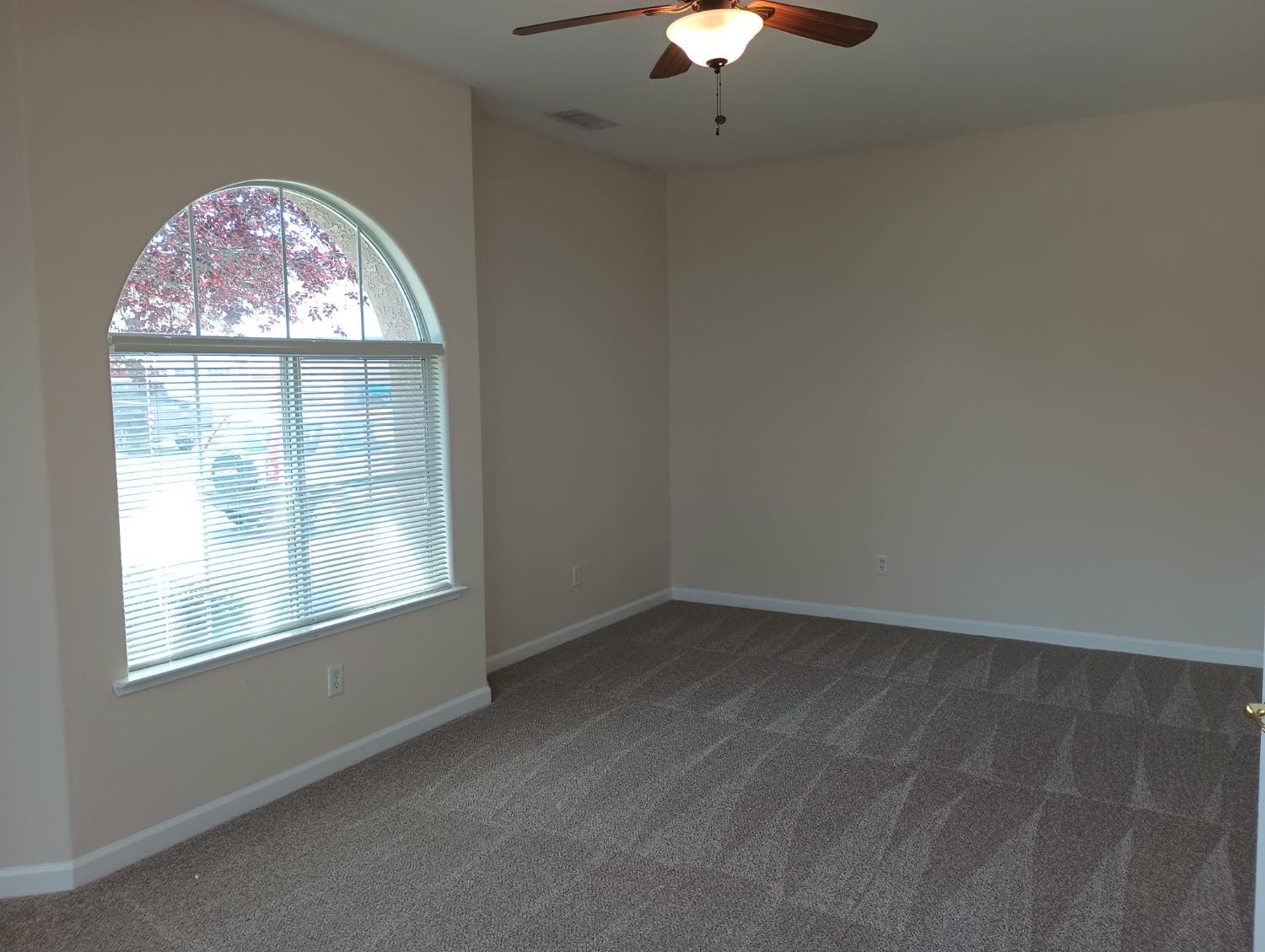 2979 Duncan Avenue Clovis, CA 93611 - Photo 9 of 27 an empty room with a window