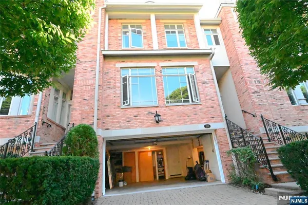 a front view of a house with garage