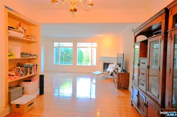 a view of living room with furniture and a floor to ceiling window