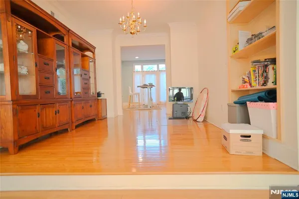 a view of a living room and kitchen with furniture