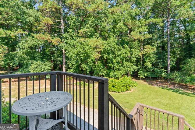 a view of a balcony with furniture