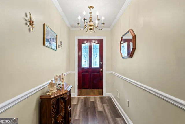 a view of entryway with wooden floor