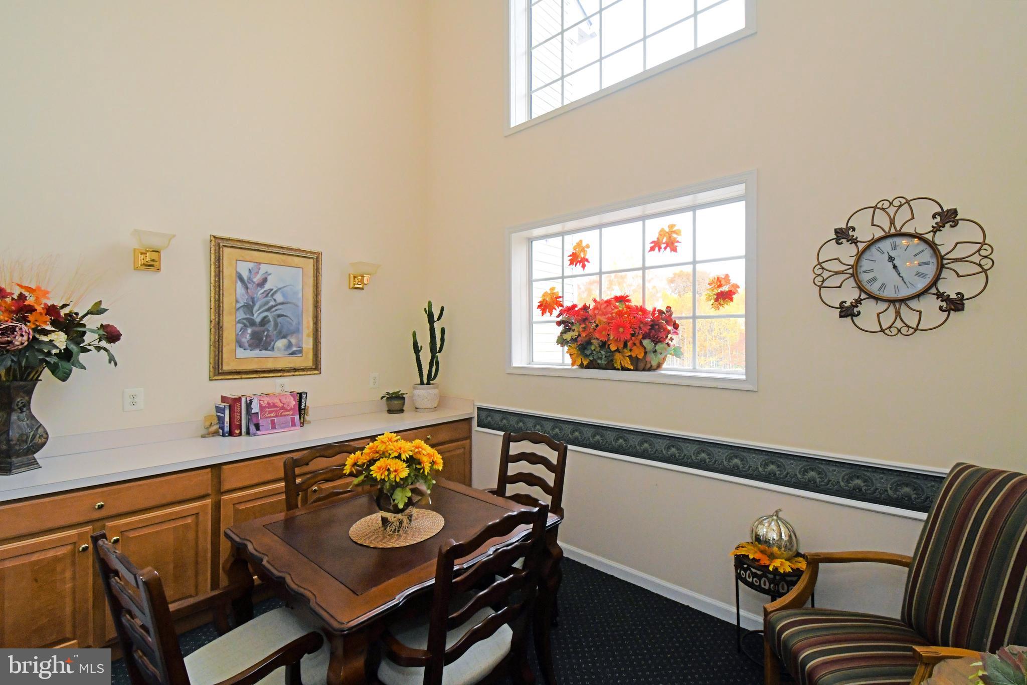 100 Ginko Street, Unit 202 Warrington, PA 18976 - Photo 11 of 53 a view of a dining room with furniture