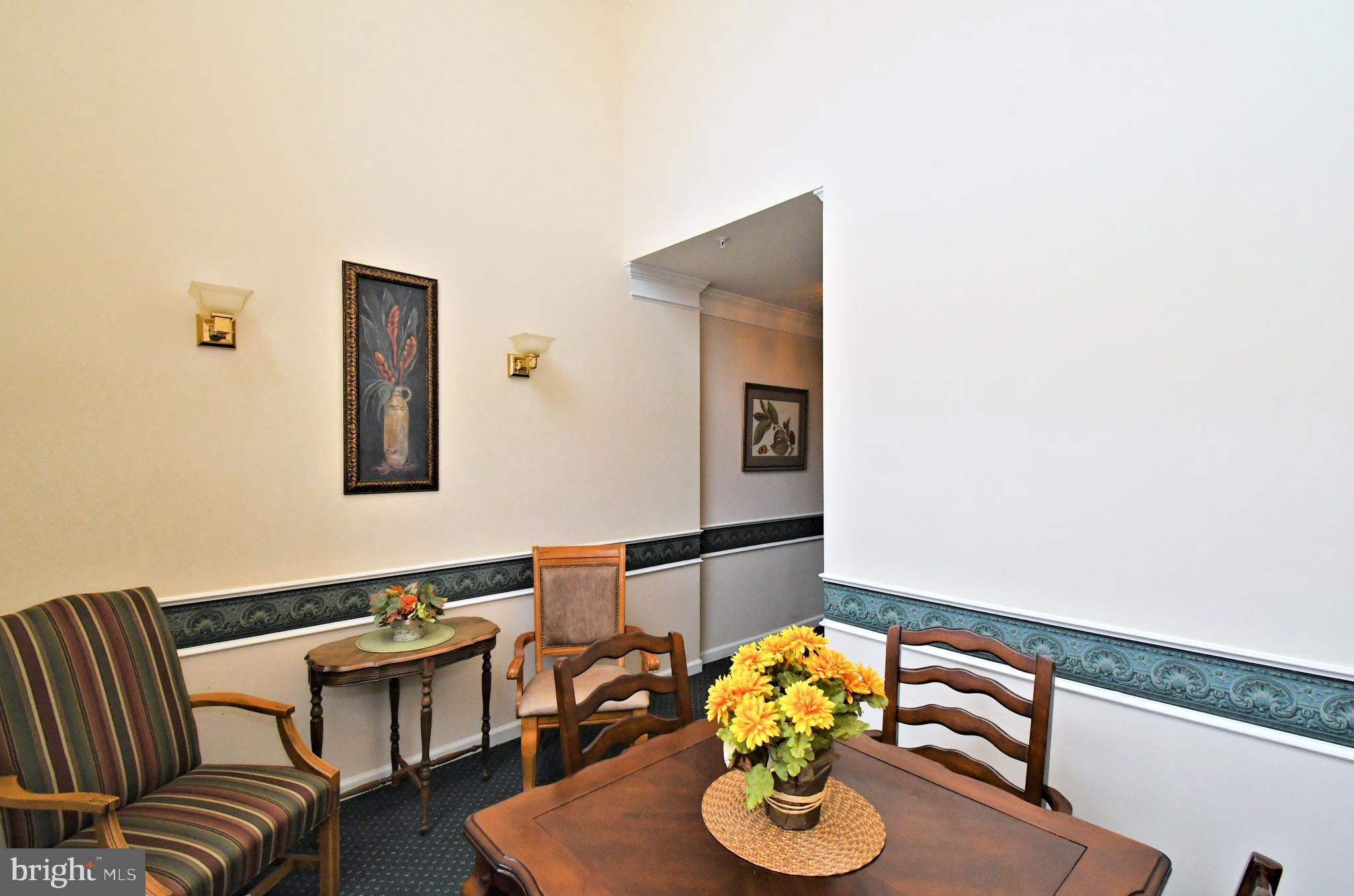 100 Ginko Street, Unit 202 Warrington, PA 18976 - Photo 12 of 53 a living room with furniture and wooden floor