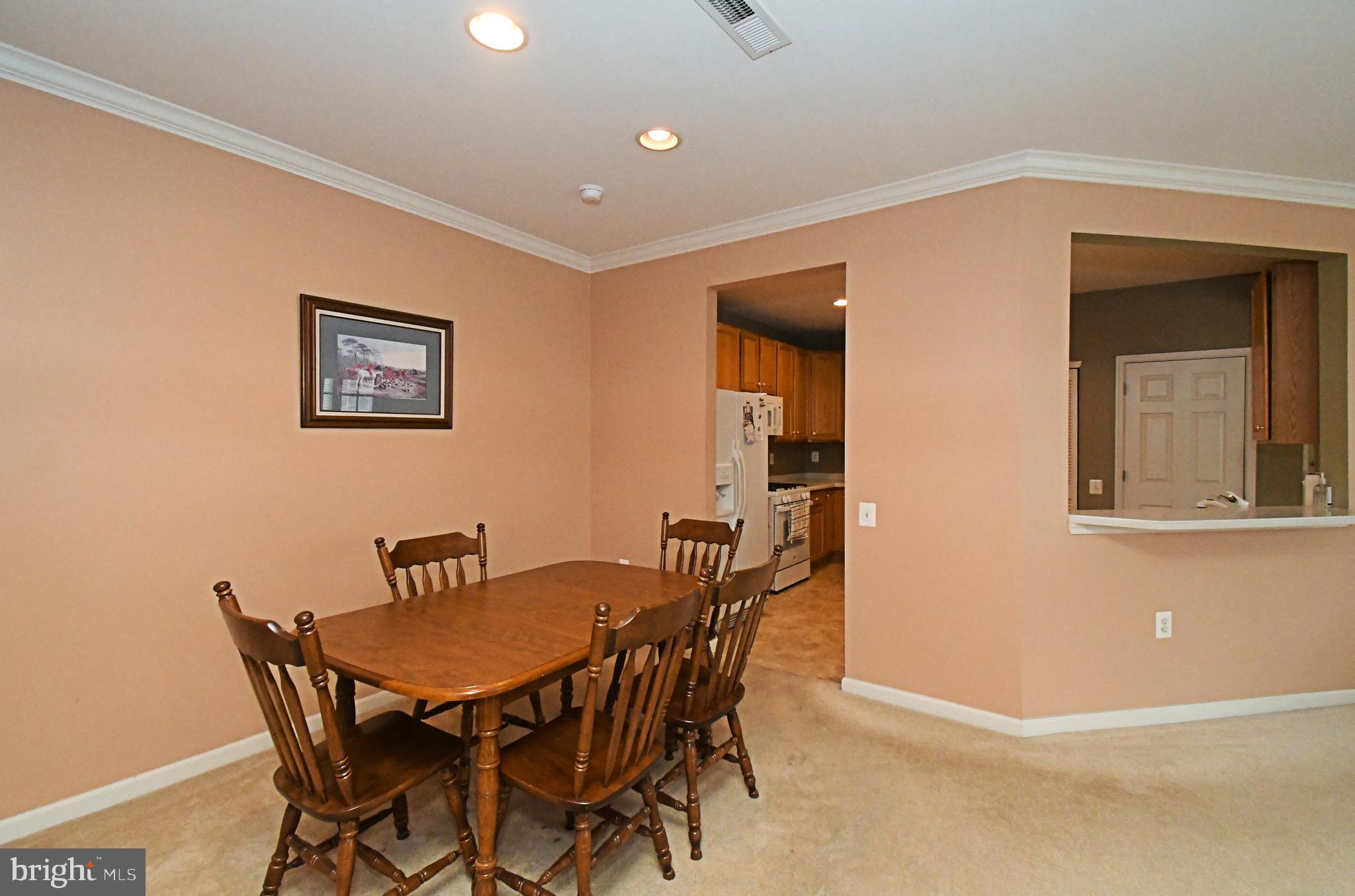 100 Ginko Street, Unit 202 Warrington, PA 18976 - Photo 16 of 53 a view of a dining room with furniture