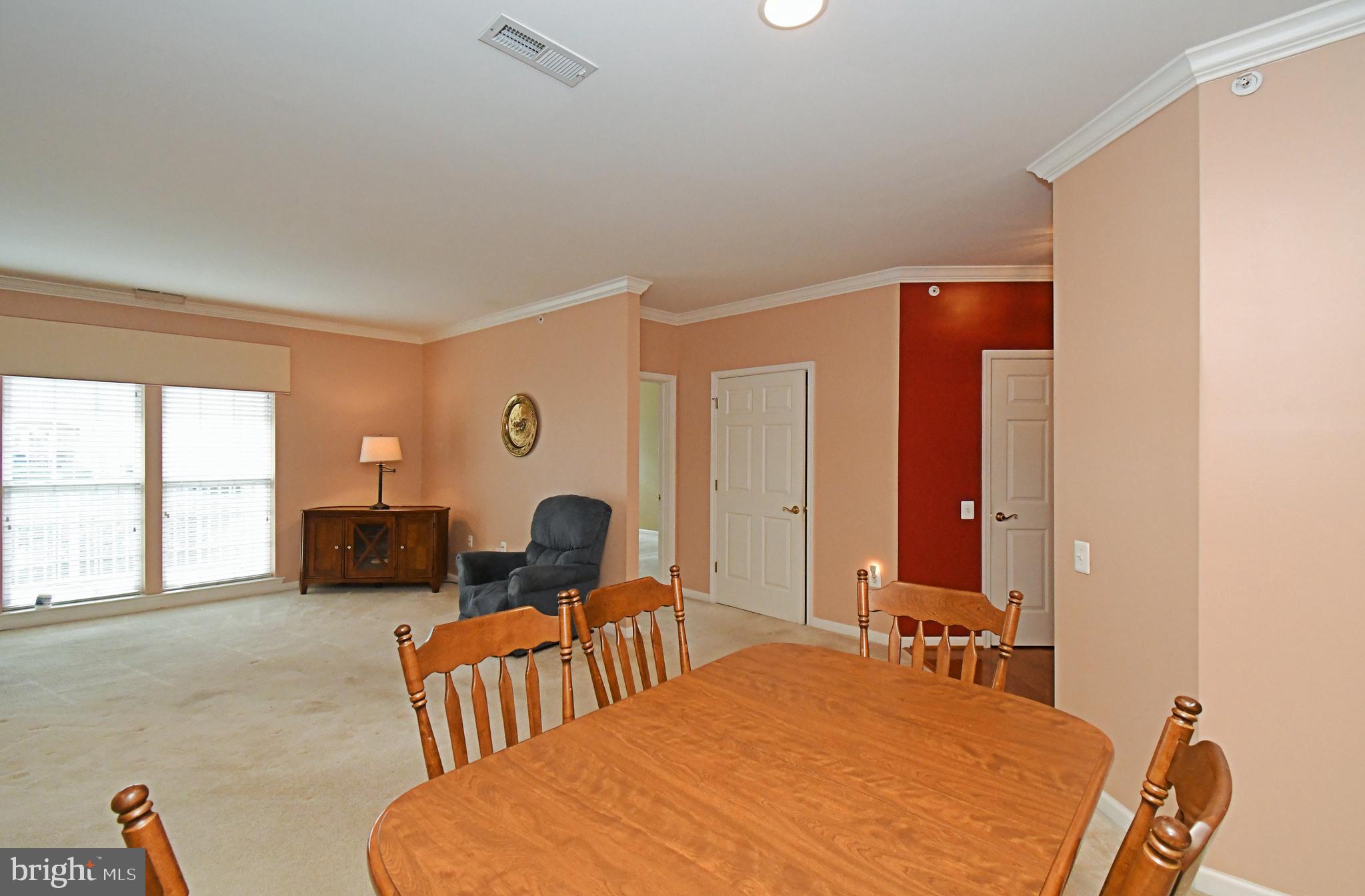 100 Ginko Street, Unit 202 Warrington, PA 18976 - Photo 18 of 53 a bedroom with a bed and a couch