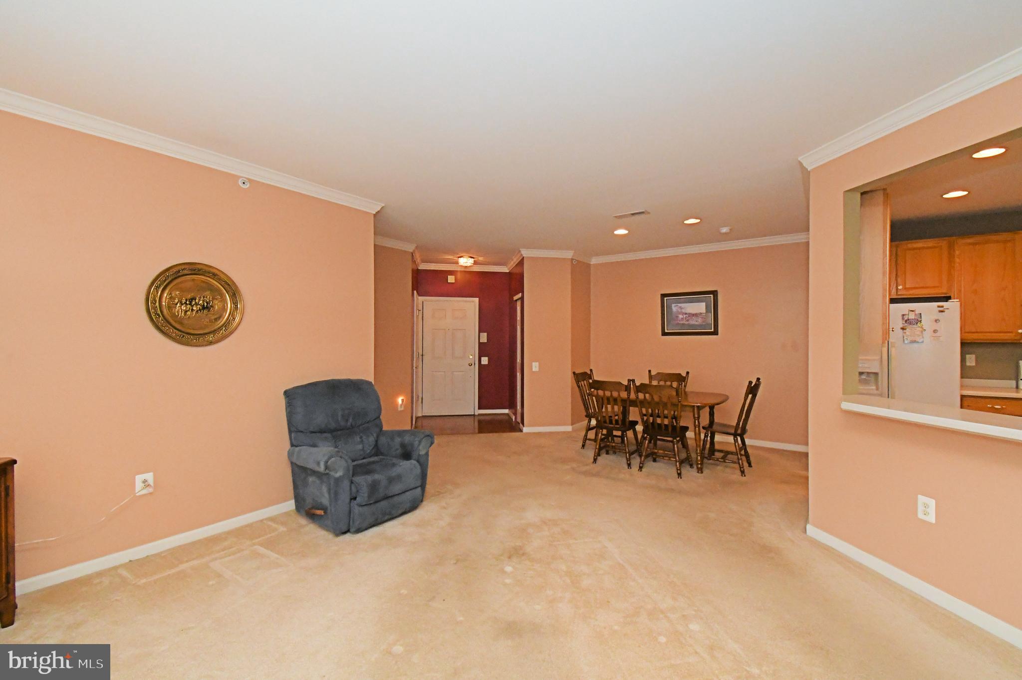 100 Ginko Street, Unit 202 Warrington, PA 18976 - Photo 21 of 53 a dining room with furniture and a table