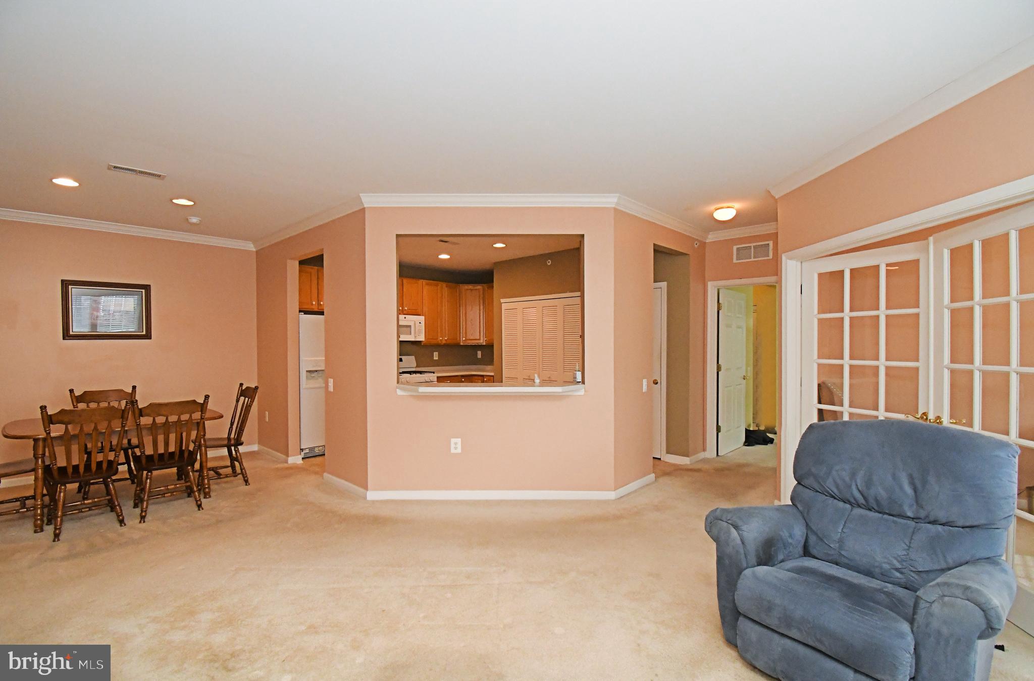 100 Ginko Street, Unit 202 Warrington, PA 18976 - Photo 22 of 53 a living room with furniture and a window