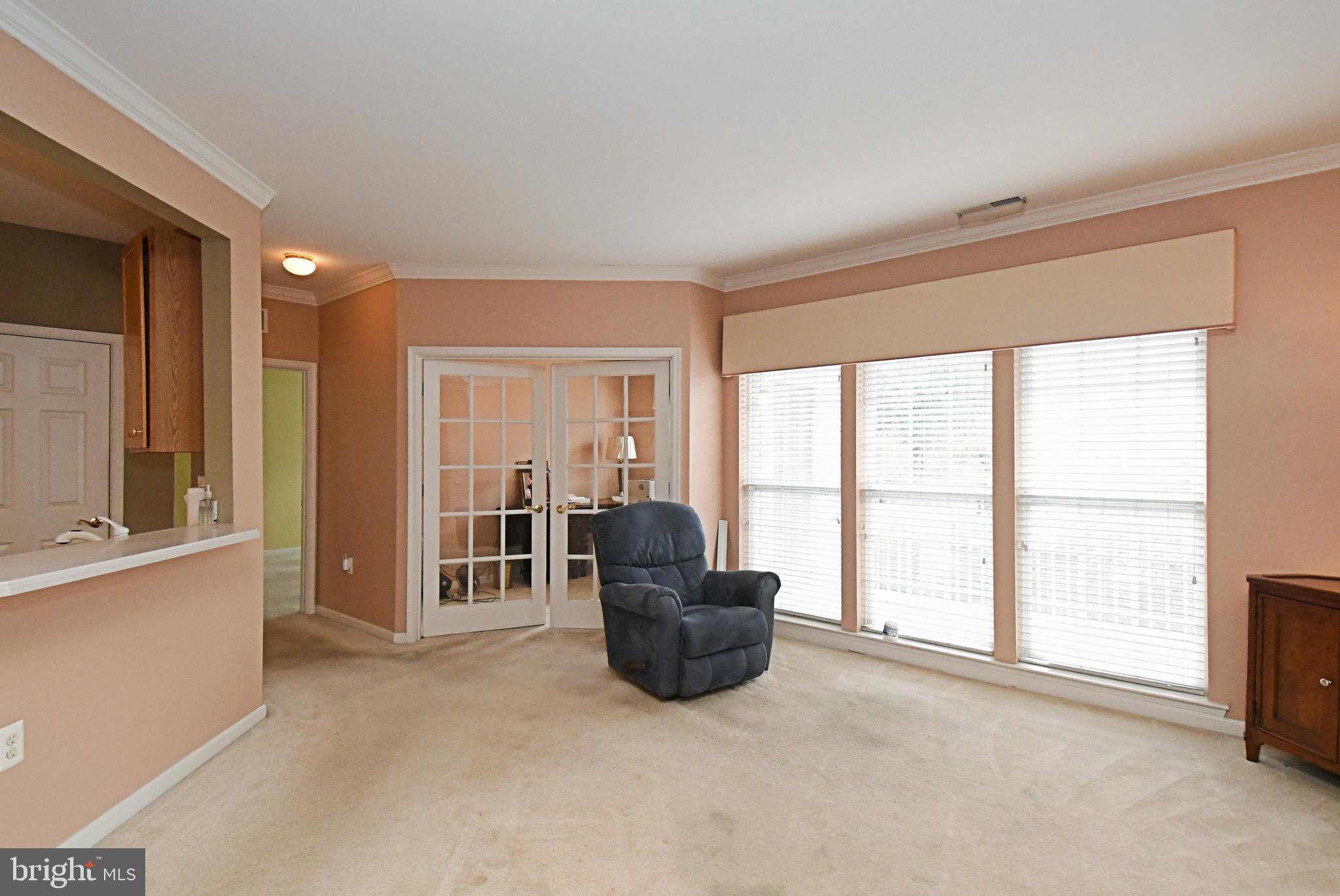 100 Ginko Street, Unit 202 Warrington, PA 18976 - Photo 23 of 53 a living room with furniture and large windows