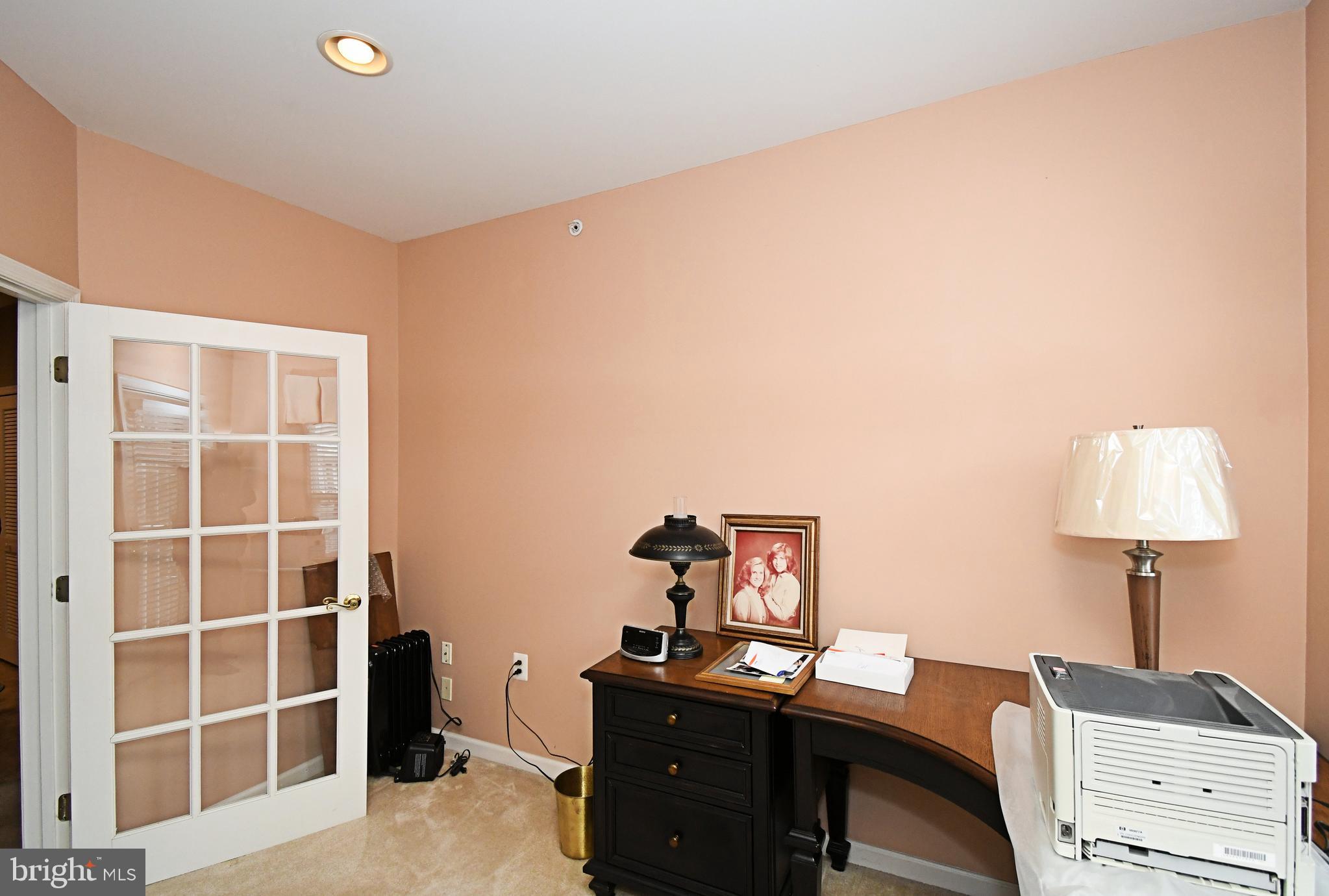 100 Ginko Street, Unit 202 Warrington, PA 18976 - Photo 32 of 53 a view of a workspace with furniture and a window