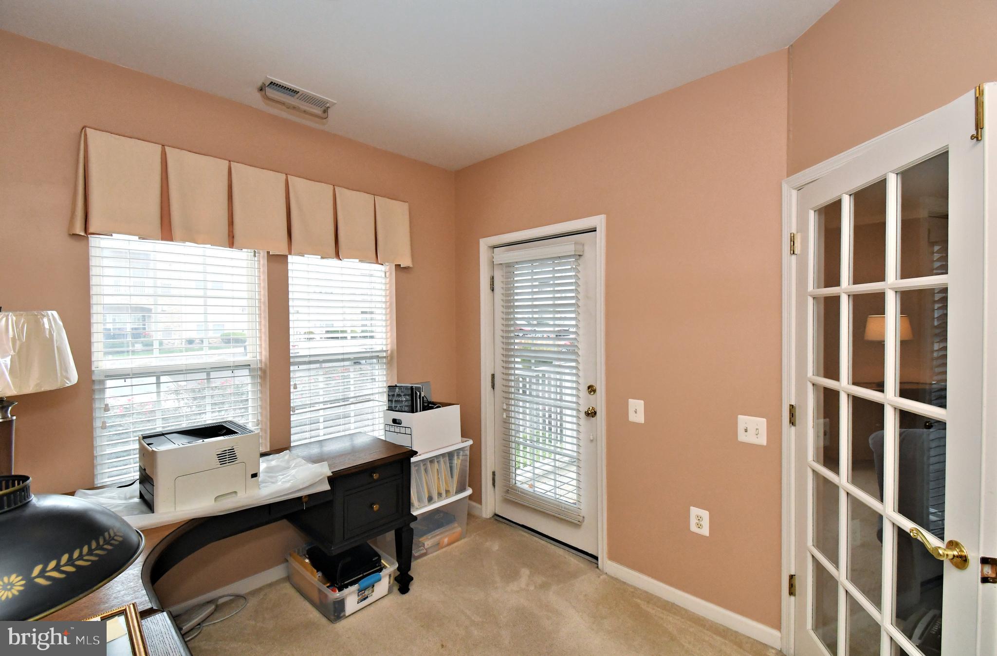 100 Ginko Street, Unit 202 Warrington, PA 18976 - Photo 33 of 53 a workspace with furniture and a window