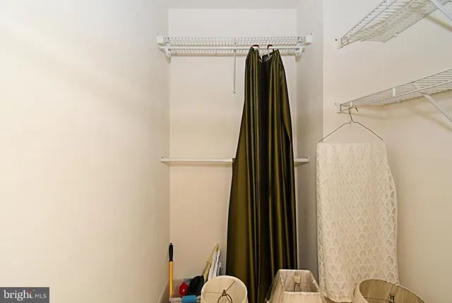 a bathroom with a shower and a sink