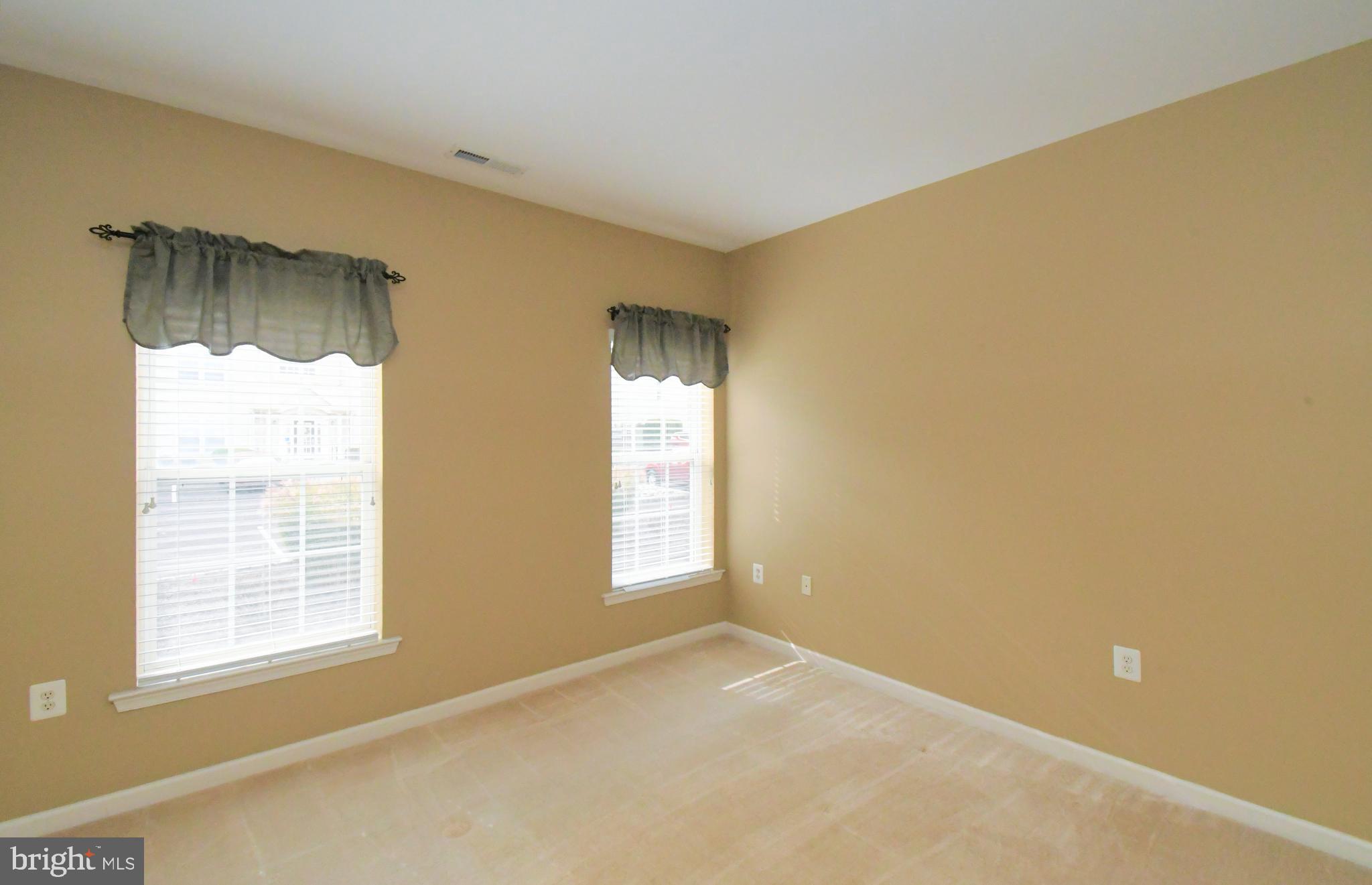 100 Ginko Street, Unit 202 Warrington, PA 18976 - Photo 43 of 53 a view of an empty room with a window