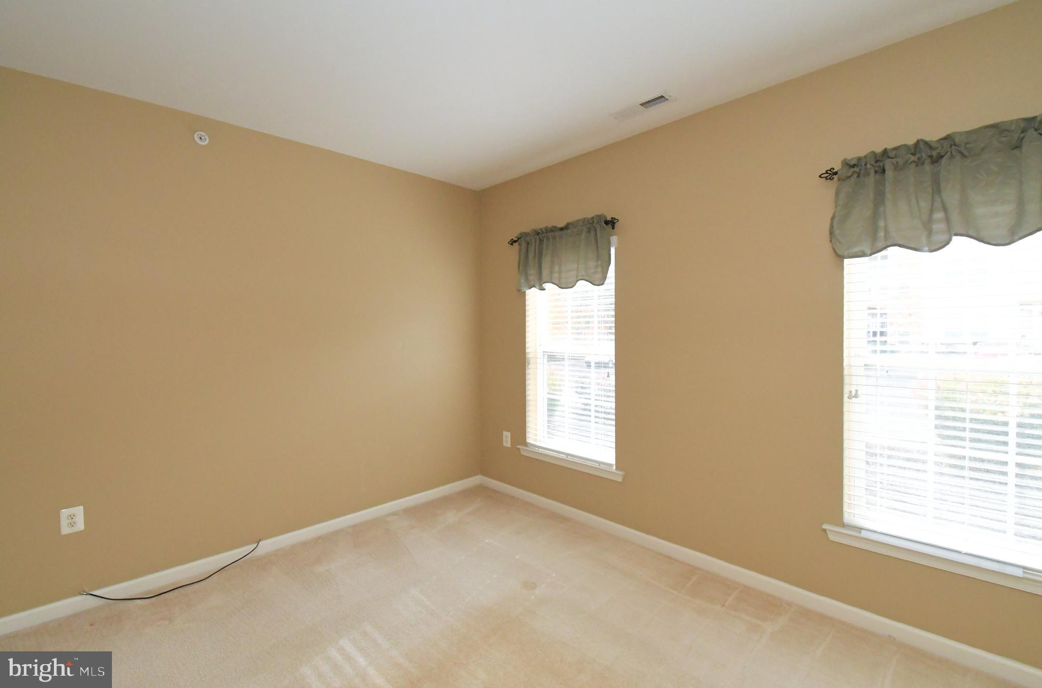 100 Ginko Street, Unit 202 Warrington, PA 18976 - Photo 46 of 53 a view of an empty room with a window