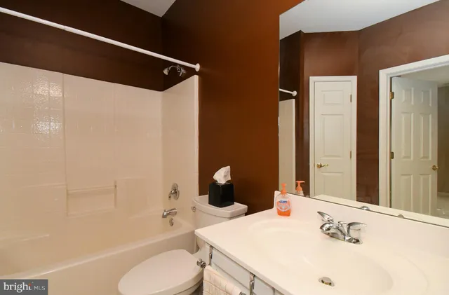 a view of a balcony and car parked