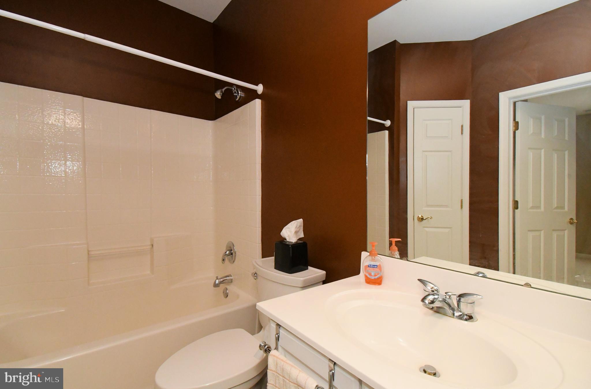 100 Ginko Street, Unit 202 Warrington, PA 18976 - Photo 47 of 53 a bathroom with a sink a toilet and shower