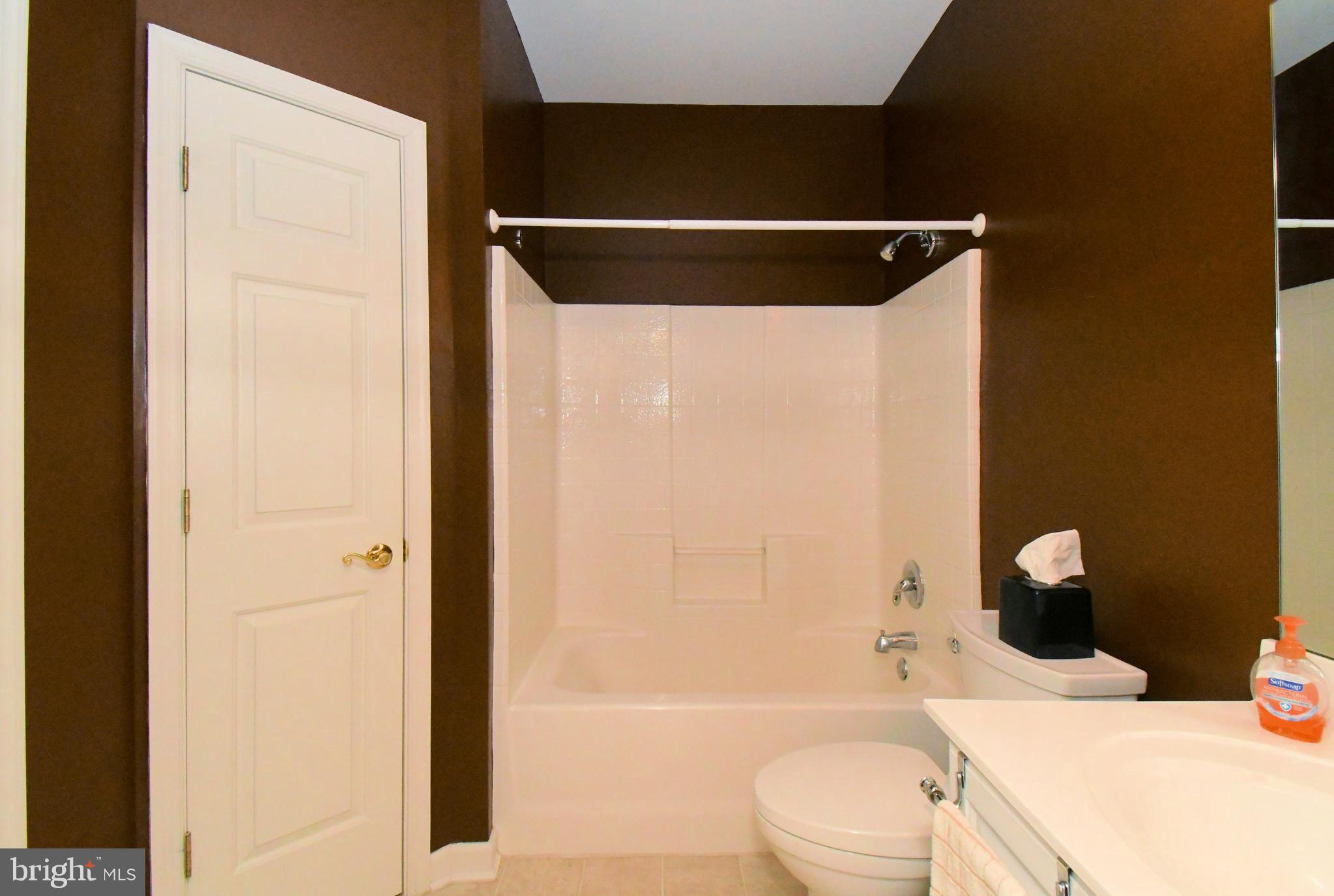 100 Ginko Street, Unit 202 Warrington, PA 18976 - Photo 48 of 53 a bathroom with a sink a toilet and shower